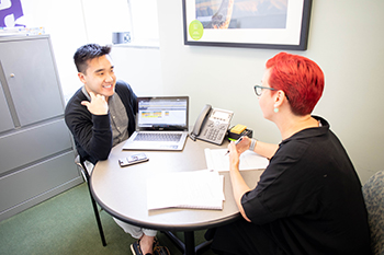 Photo of two researchers meeting