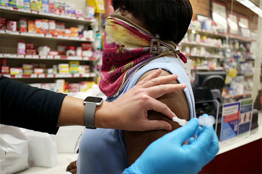 Clem Williams, 76, receiving her second booster shot in Durham, N.C. in May.Credit...